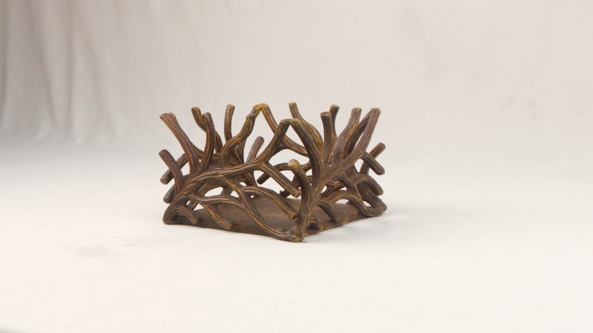 A Celestyn wooden wall piece resting in the workshop